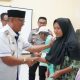Wakil Bupati Serahkan 900 Sertifikat Tanah untuk Warga Desa Labokong